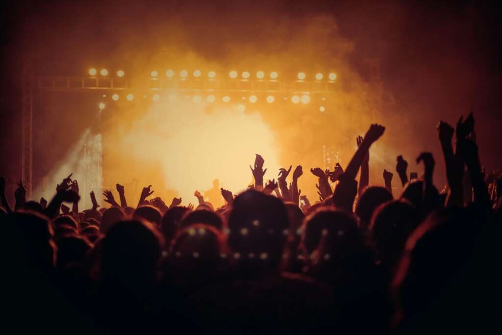 Concert crowd in warm golden light