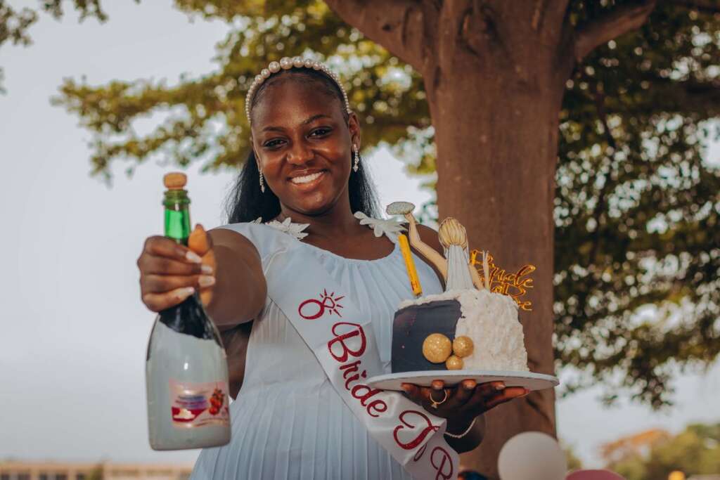Bride-to-be celebrating with champagne outdoors