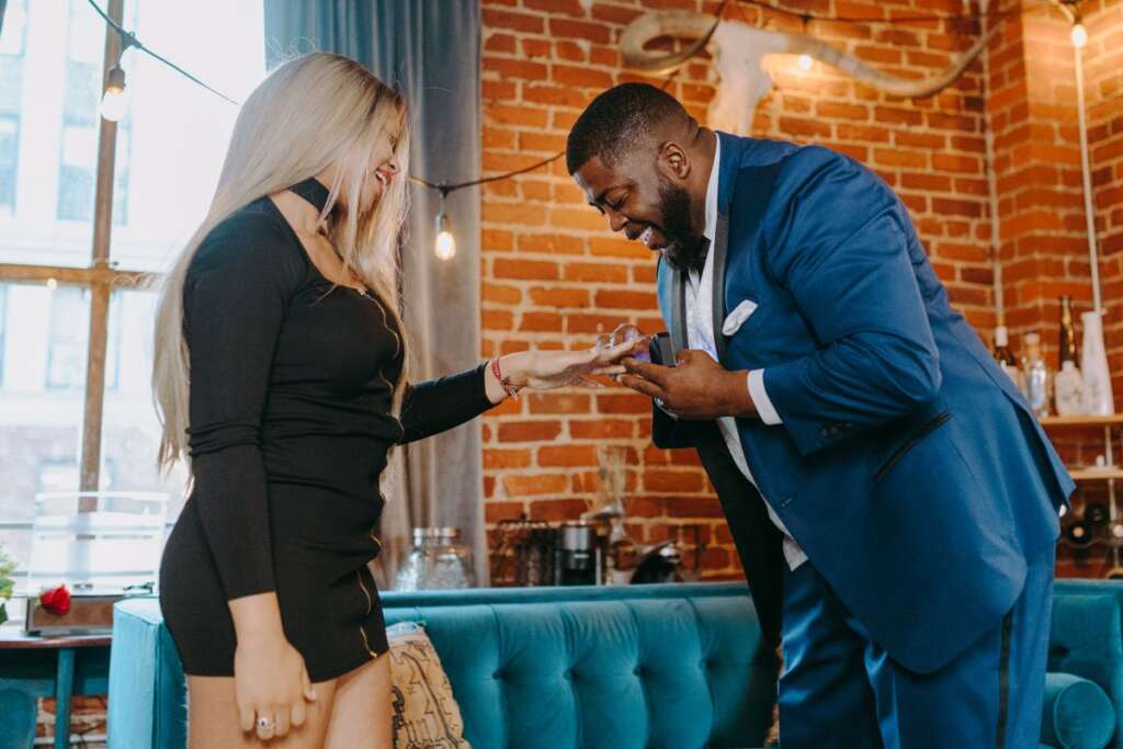 Man proposing with a ring at an engagement