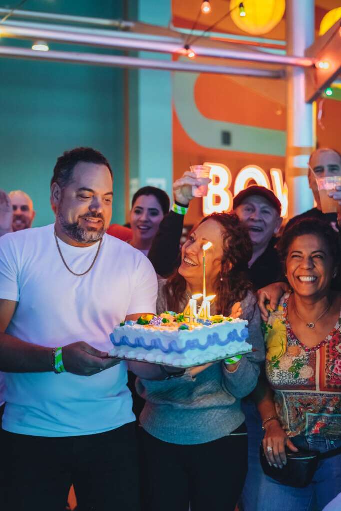 Family celebrating a graduation with cake