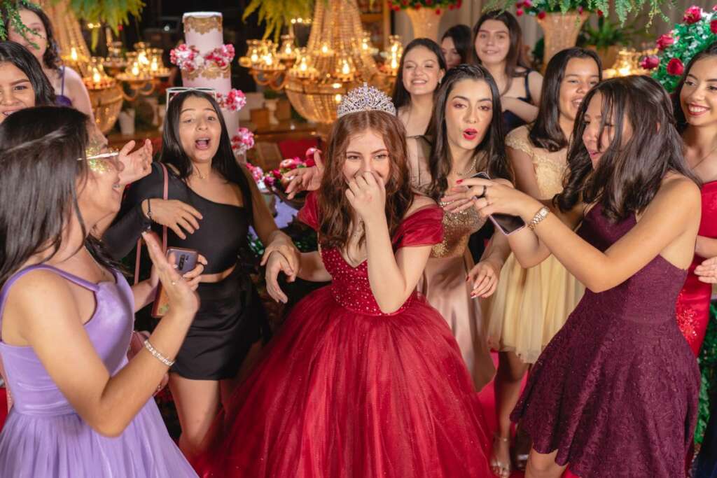 Quinceañera celebrating with her friends